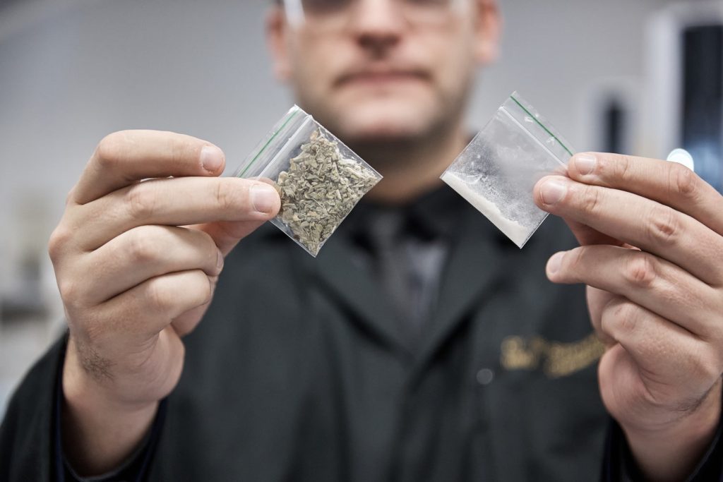 Understanding the Risks of Alcohol and Drugs Person holding small bags of alcohol and drugs