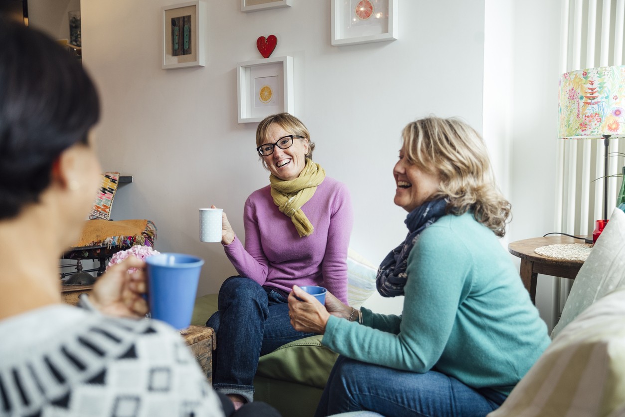 Supportive Group Chat for Alcohol Recovery Journey Women in cozy living room discussing alcohol recovery